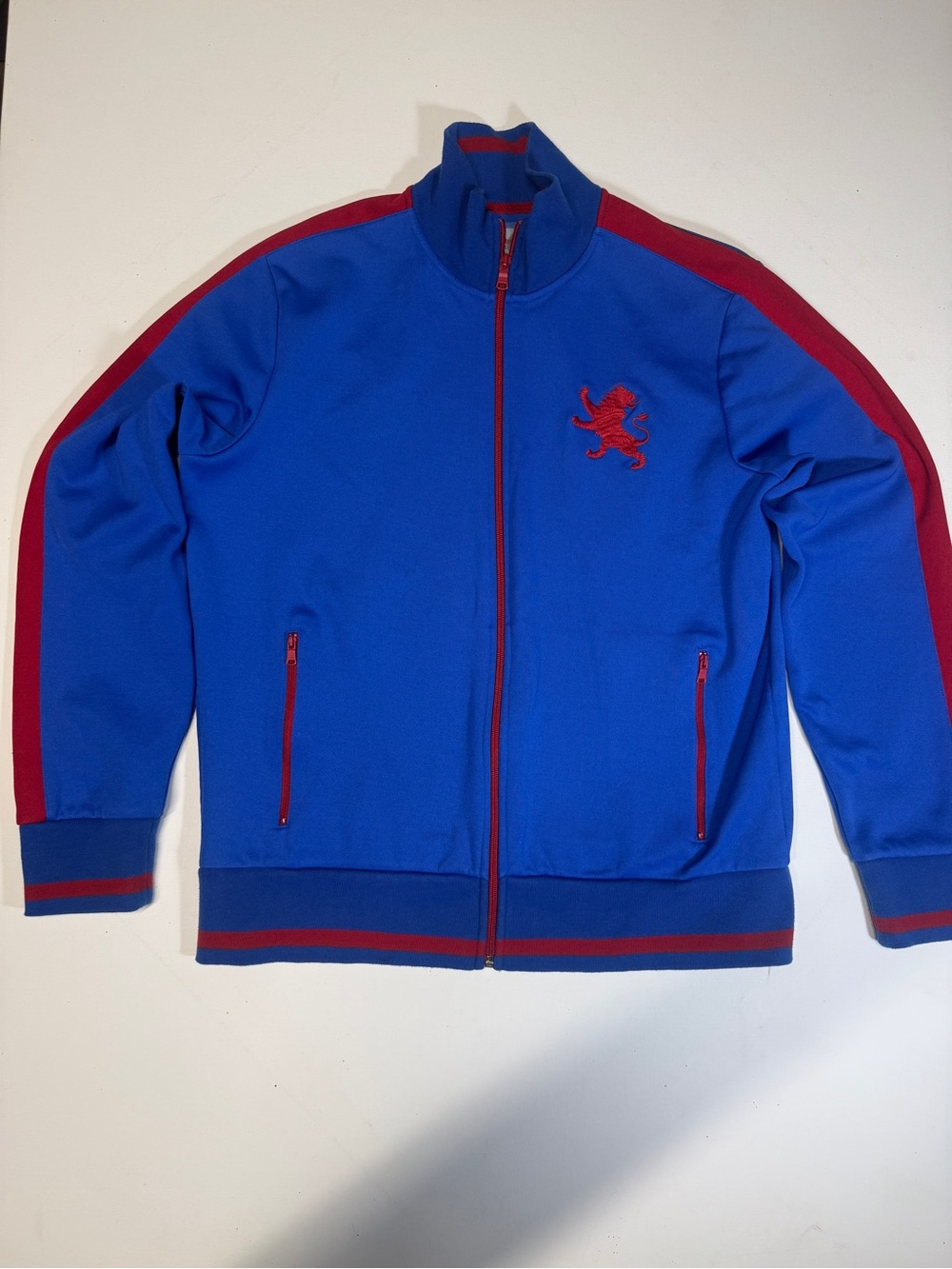 Express Blue Track Jacket with Red Accents and Lion Crest